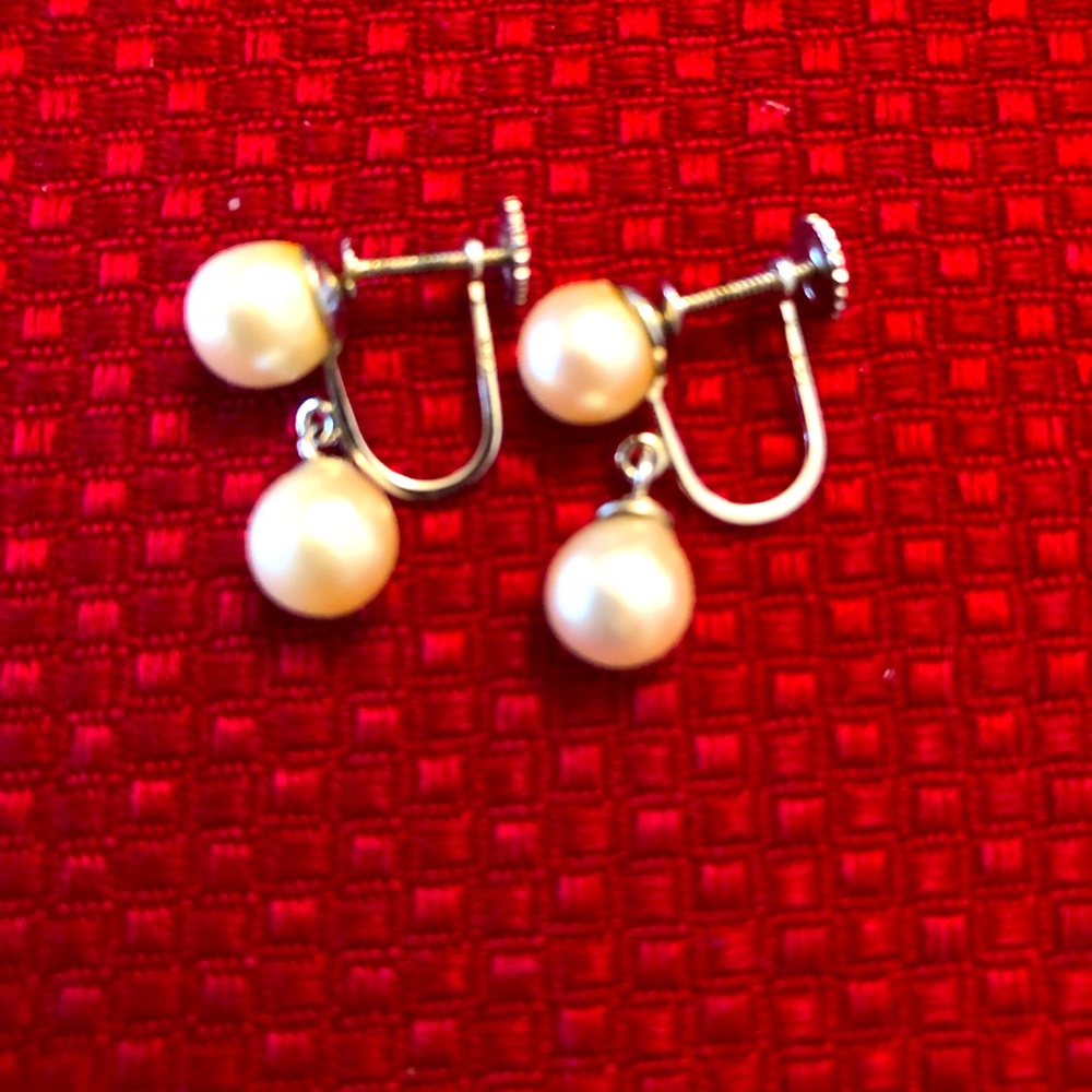 Pearl earrings with screw backings 14k white. Vintage elegant with little chain.